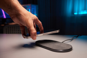 smartphone wireless charging on induction charger. Wireless charger