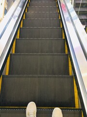 Escalator or moving staircase. Consist of step, handrail. Powered by electric motor for carry...