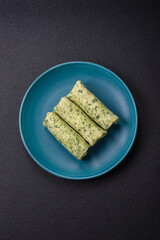 Delicious fresh pancakes with spinach, cream cheese, salmon, salt and spices