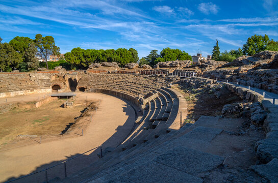 Steps and the arina of the Roman Amphitheater of M&eacute;rida illuminated by the light of dawn creating shadows from its steps in Badajoz, Extremadura, Spain. World Heritage City. (1st century BC).