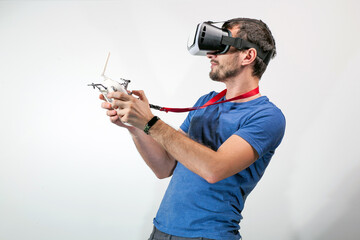Man wearing virtual reality goggles. A guy with virtual reality glasses controls a flying drone
