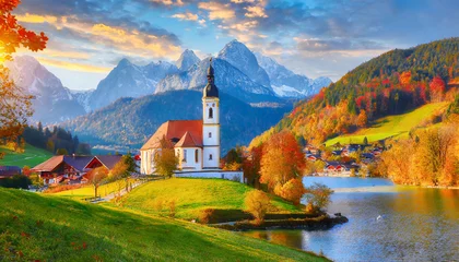 Foto op Canvas iconic picture of bavaria with maria gern church with hochkalter peak on background sunny autumn scene of alps beautiful landscape of germany countryside beautiful autumn scenery © Emanuel