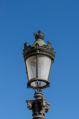 Fototapeta na wymiar Old ornate iron street light in Barcelona, Catalonia, Spain, Europe