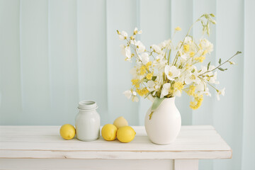 Stylish Table Decoration Featuring White Vase and Lemons