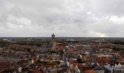 Fototapeta na wymiar Breathtaking panoramic view from the Belfry of Bruges, capturing the city's red-roofed houses and the iconic Sint-Salvatorskathedraal