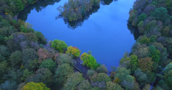 Aerial video of Heaton Park boating lake showing the colours of Autumn