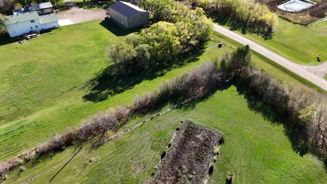 Ascend above Gruenthal, Saskatchewan, revealing the essence of this small community. The drone footage showcases its agricultural surroundings, quaint residences, and the charm of rural life.