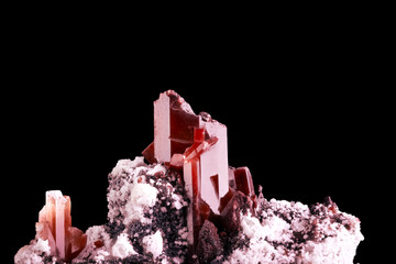 red topaz macro detail black isolated background. close-up rough raw unpolished semi-precious...