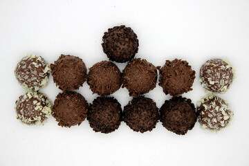 Several chocolates on white background