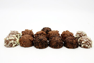 Several chocolates on white background