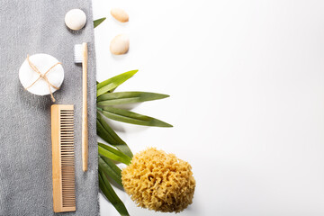 Zero waste, sustainable bathroom and lifestyle. Bamboo toothbrush, loofah sponge, cotton pads over...