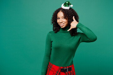Merry little kid teen girl wear turtleneck hat casual clothes posing doing phone gesture like says...