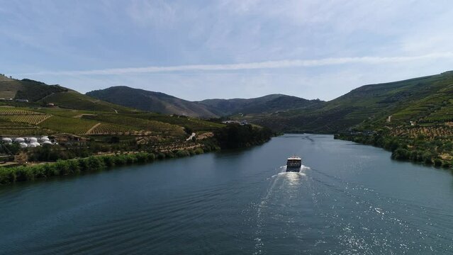 Cruise ship sailing across The River Douro - Aerial footage