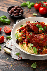 Cacciatore Chicken with spaghetti, vegetables, olives and tomatoes