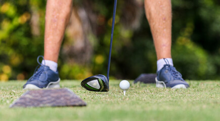 Approaching initial golf drive shot with golf ball on a tee on a  golf course in Central Florida