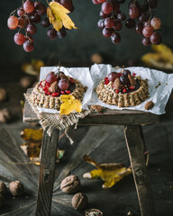 Breakfast Tarts Granola Tartlets with Nuts, Chocolate, pomegranate  and Grapes 