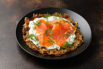 Potato rosti with dill yogurt dip sauce and smoked salmon