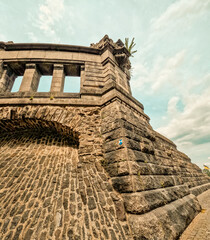 Obraz premium Ancient Medieval Fortified Surrounding Wall at the Deutsches Eck in Koblenz, Germany.