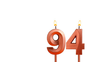 Birthday candle number 94 on white background