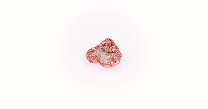 copper nugget 360&deg; rotation in 4k macro isolated on white background. macro detail  background. close-up Rough raw unpolished semi-precious gemstone