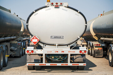 Flammable load. Gasoline transport truck with a full tank in the refinery