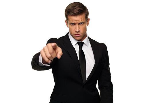 Angry businessman or boss blaming and pointing finger toward camera in black suit and tie isolated on white background.