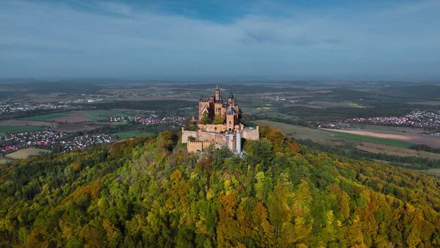Aerial drone view of medieval Hohenzollern castle on top of hill in autumn, Baden-Wurttemberg, Germany. High quality 4k footage