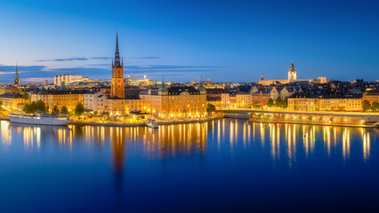 Fototapeta na wymiar Stockholm, Sweden. Panoramic view of the Gamla Stan. The capital of Sweden. Cityscape during the blue hour. View of the old town in Stockholm. Large resolution photo for background and wallpaper.