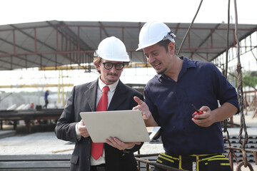 engineering team working on site of construction worker at site.