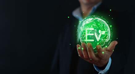 Businessman show Ev icon Light bulb, EV concept, Hand of human holding global with EV icons, Green...