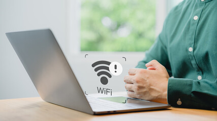 User using a laptop computer to connect to wifi but wifi not working or password is incorrect and...