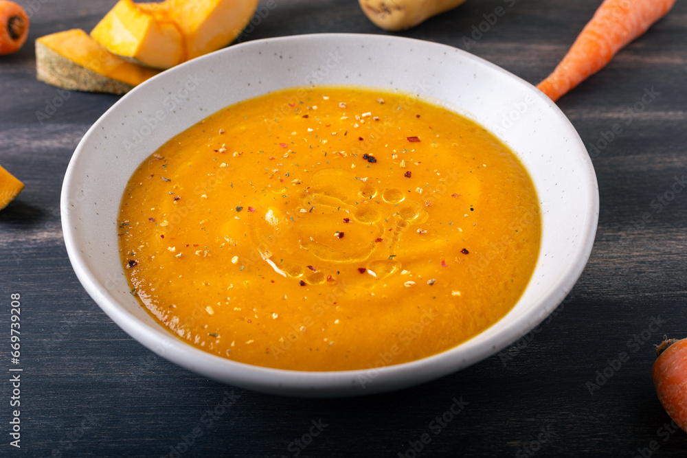 Poster Pumpkin and carrot cream soup. Autumn dish suitable for lunch and dinner.