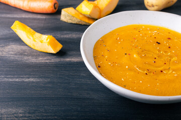 Pumpkin and carrot cream soup. Autumn dish suitable for lunch and dinner.