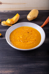 Pumpkin and carrot cream soup. Autumn dish suitable for lunch and dinner.