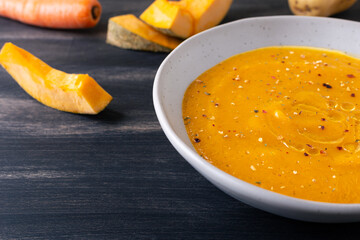 Pumpkin and carrot cream soup. Autumn dish suitable for lunch and dinner.