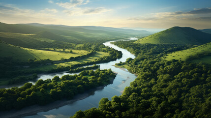 A winding river meandering through a sunlit landscape of rolling hills