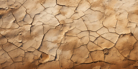 Top view of dry dirty ground, cracked clay texture background, weathered soil pattern. Concept of drought, earth, nature, desert, global warming and climate change
