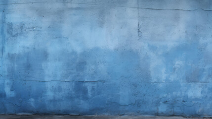 Alte Betonwand mit Rissen und blauer Farbe.