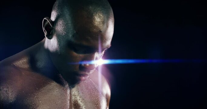 Muscle, sweat and the body of a black man boxer in studio for a workout or abs while training in self defense. Fitness, boxing and breathing with a serious athlete shirtless on a dark background