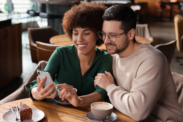 International dating. Lovely couple spending time together in cafe