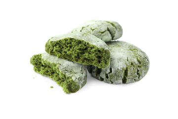 Tasty whole and broken matcha cookies on white background
