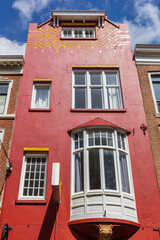 Red facade on a historic house in Den Haag, Netherlands