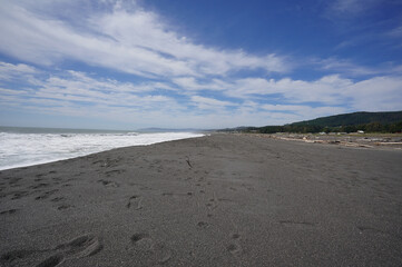 Black sand beach in Chile during windy day (Maule region, Constitucion) 