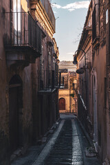 The narrow streets of the baroque style city of Modica, Sicily, Italy - 669770636