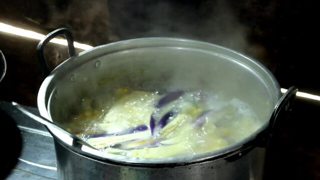 eggplants swaying in simmering corn soup
