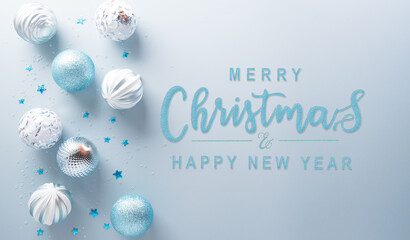 Christmas and new year background decoration concept. Top view of Christmas ball,  star and snowflake on pastel blue background.