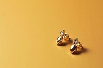 Close-up of gold earrings on solid color background. Generative AI - obrazy, fototapety, plakaty