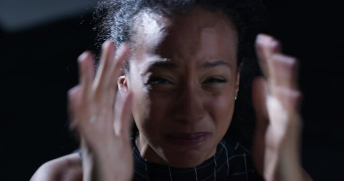 Woman, scream and kidnapping victim shouting with stress, fear and danger for terrorism and horror. Scared girl, ransom and portrait of female hostage in crisis, prison and cry for help in dark room.