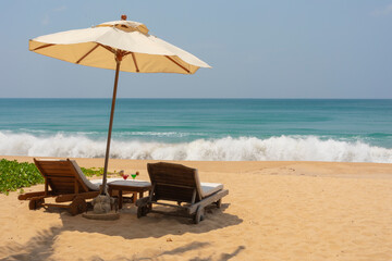 lounge chairs and umbrella on the beach