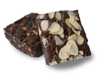 Pieces of fresh delicious chocolate and almond nut brownies, cut out isolated